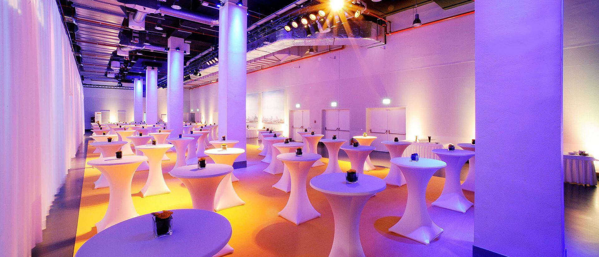 reef berlin event area set up with cocktail tables